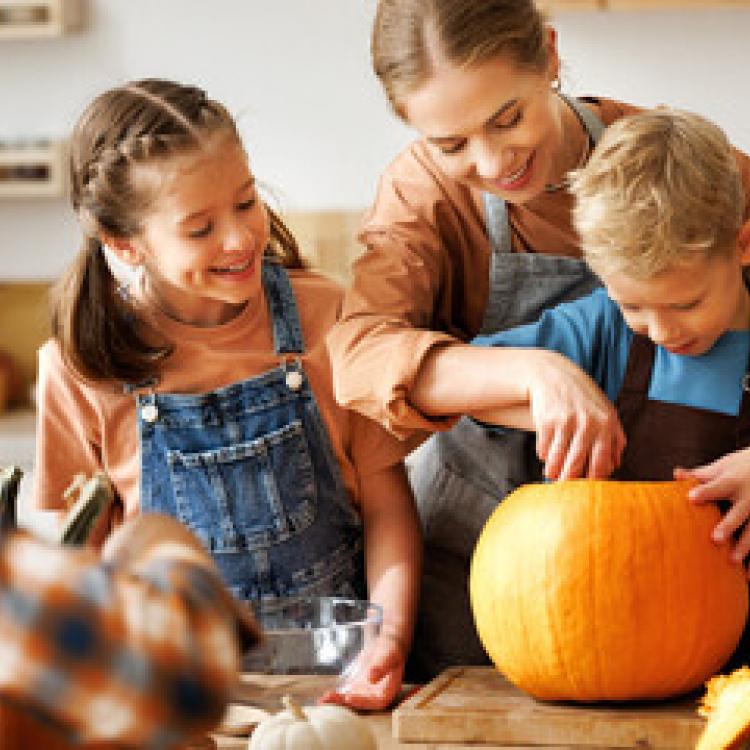 Family carving pumpkins